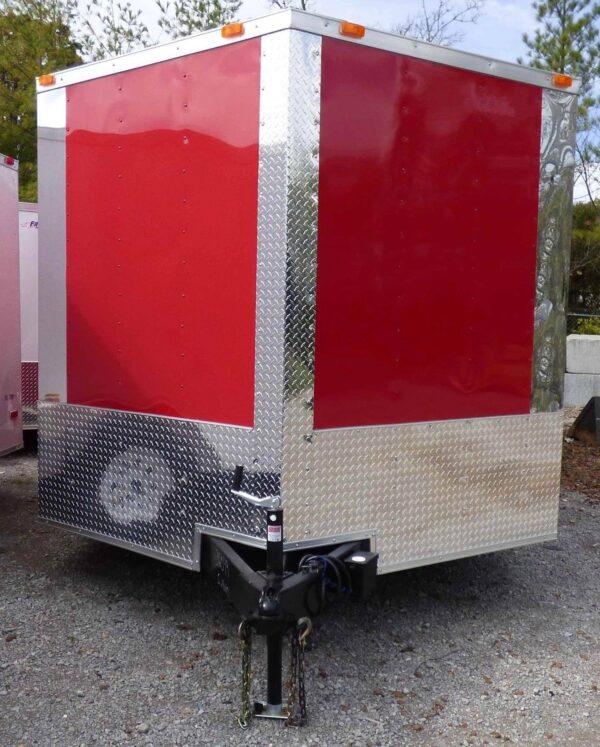 Side view of 8.5x24 red and black enclosed trailer