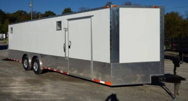 Side view of 8.5x28 white enclosed motorcycle car event trailer